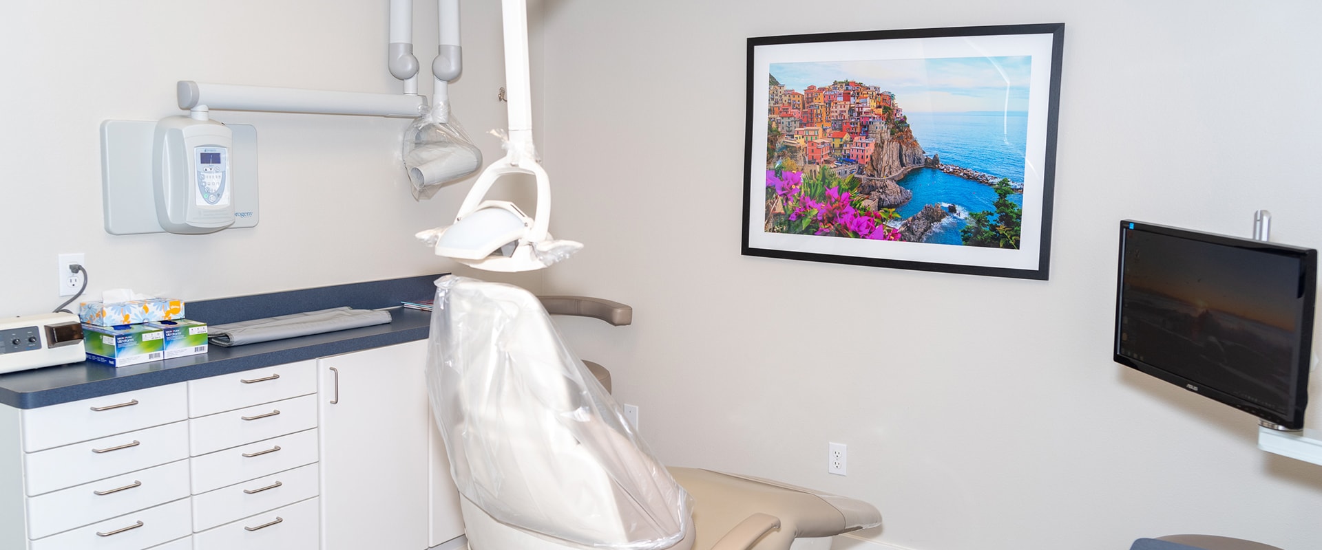 Inside one of the treatment rooms of Smokey Point Family Dentistry with a monitor and dental chair